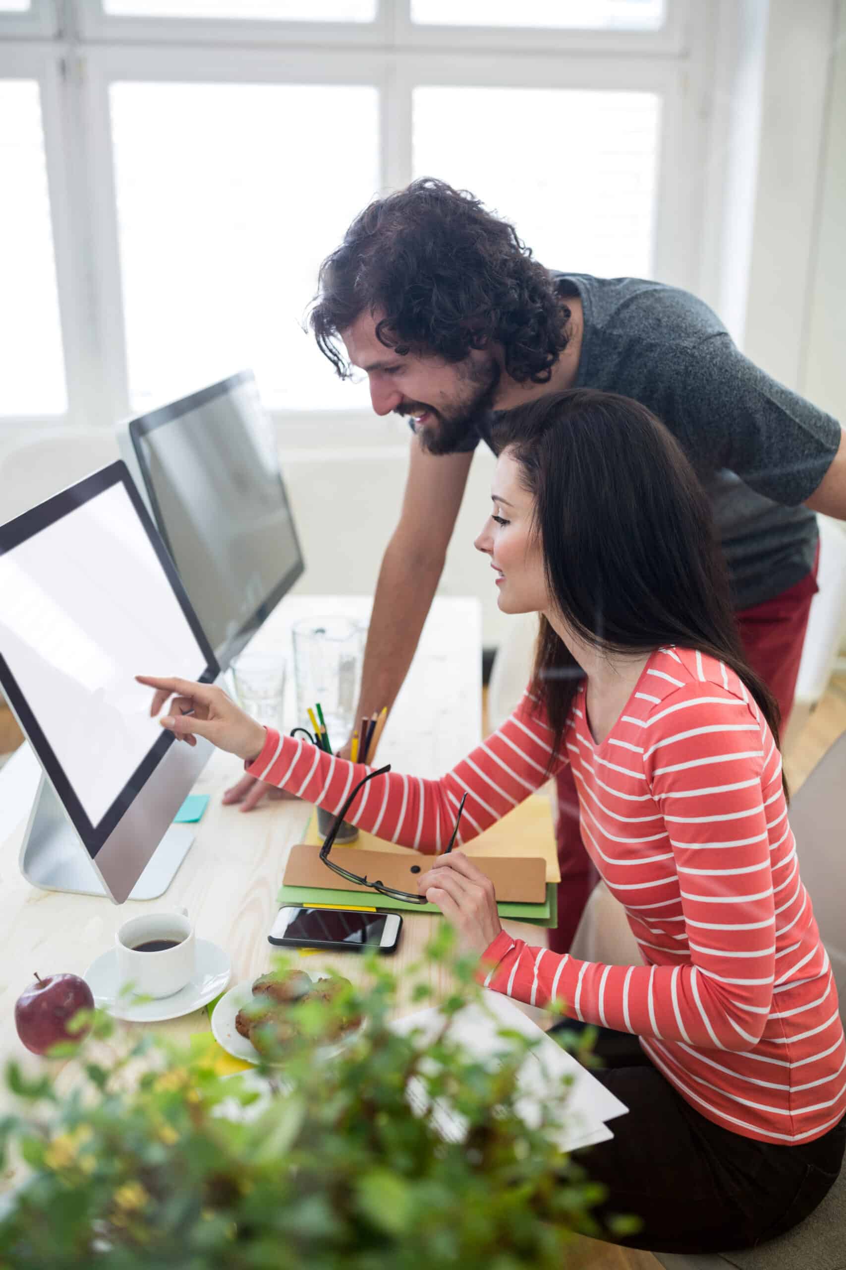 male female graphic designers interacting computer scaled